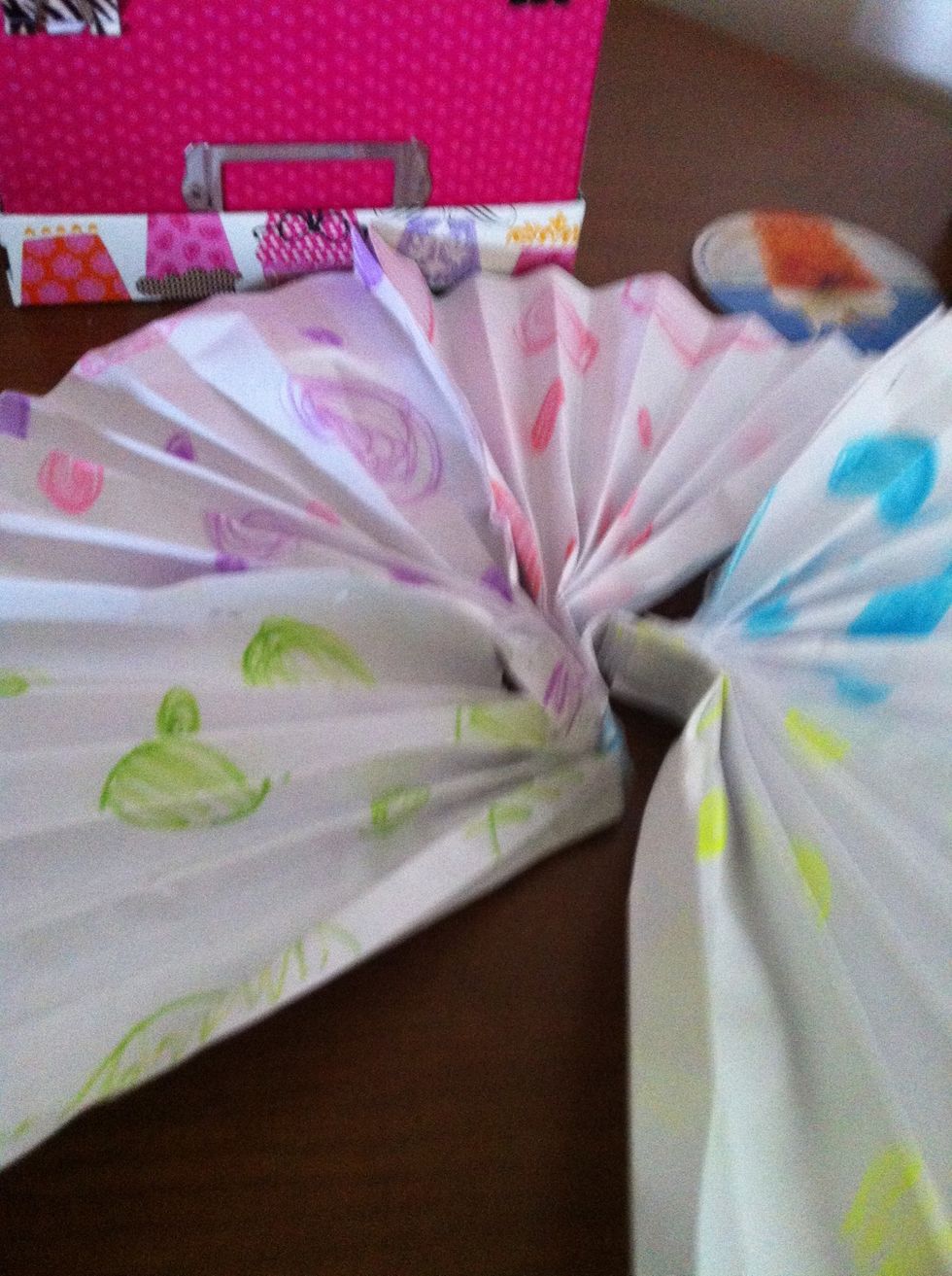 Make a ton of little fans and then staple or tape them together
