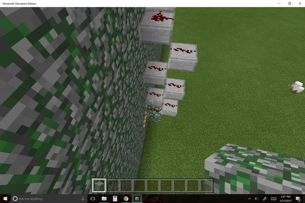 Make a vertical redstone trail by using slabs in this pattern. Do this to the roof or just high enough for everybody to see if it's outside.