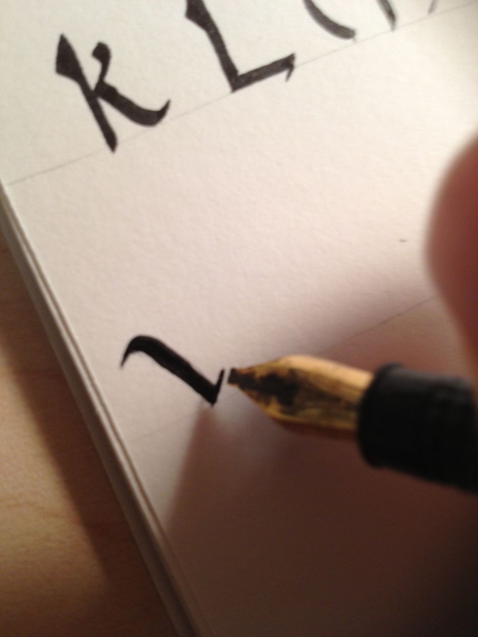 Make a very short second diagonal stroke upwards, maintaining nib angle.