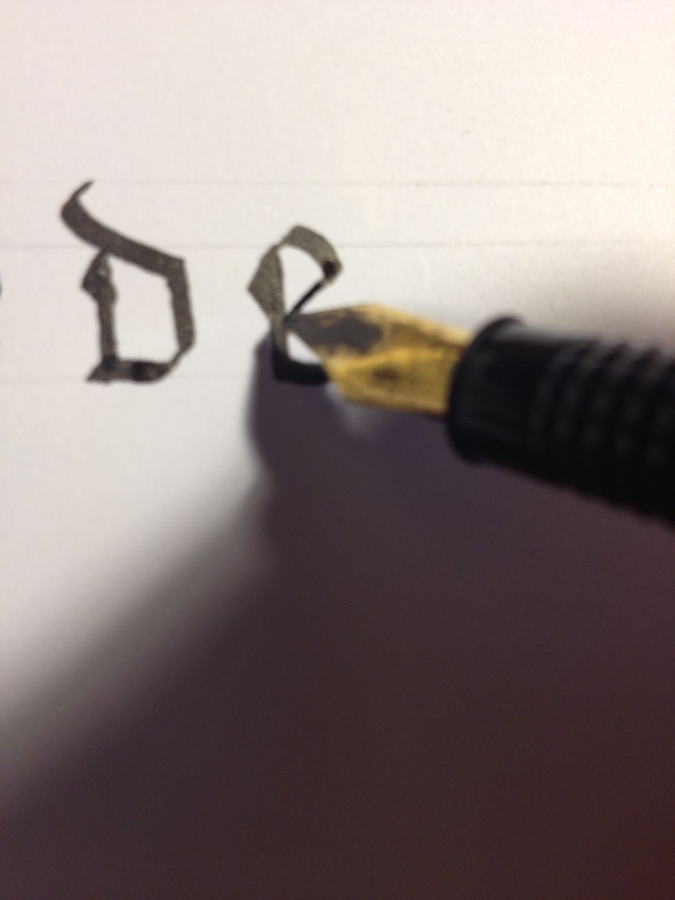 Make a very short thin upward diagonal from the top of the trunk, then a thick downward curve, and finally a thin downward diagonal terminating back at the trunk.