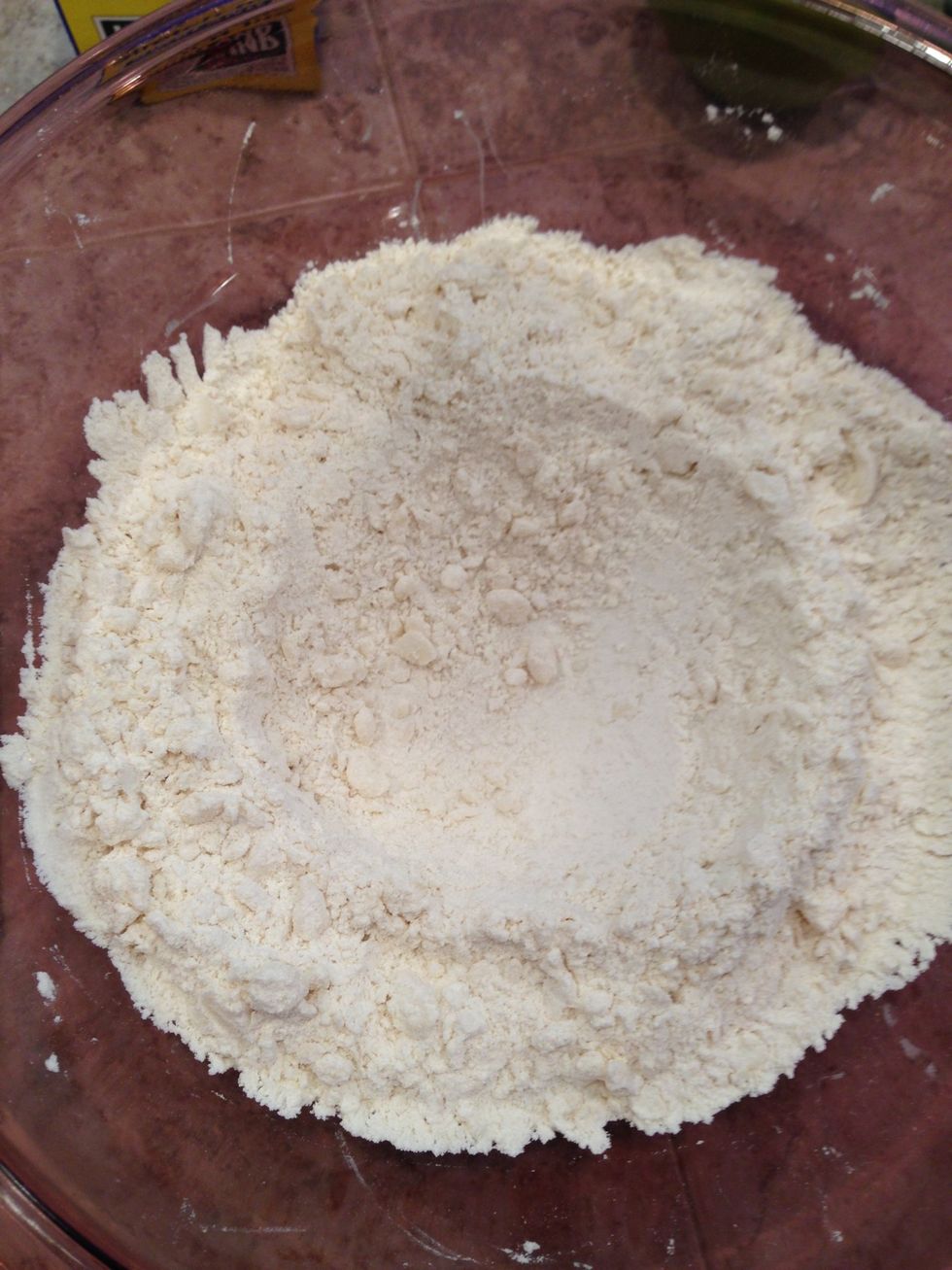 Make a well in center of flour mixture.