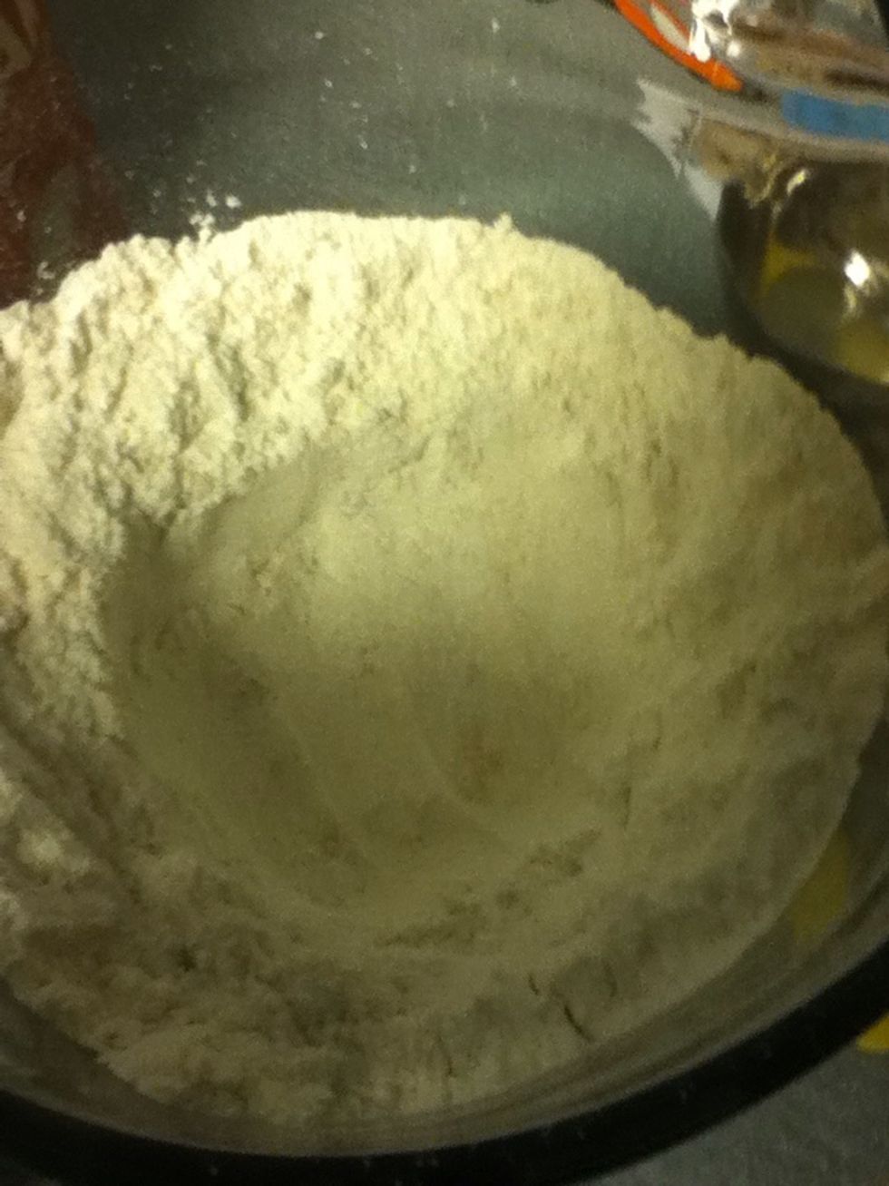 Make a well in the dry mixture.