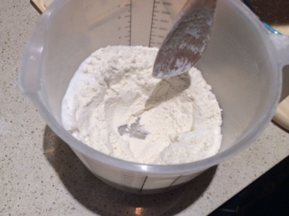 Make a well inside the bowl with the flour and sugar