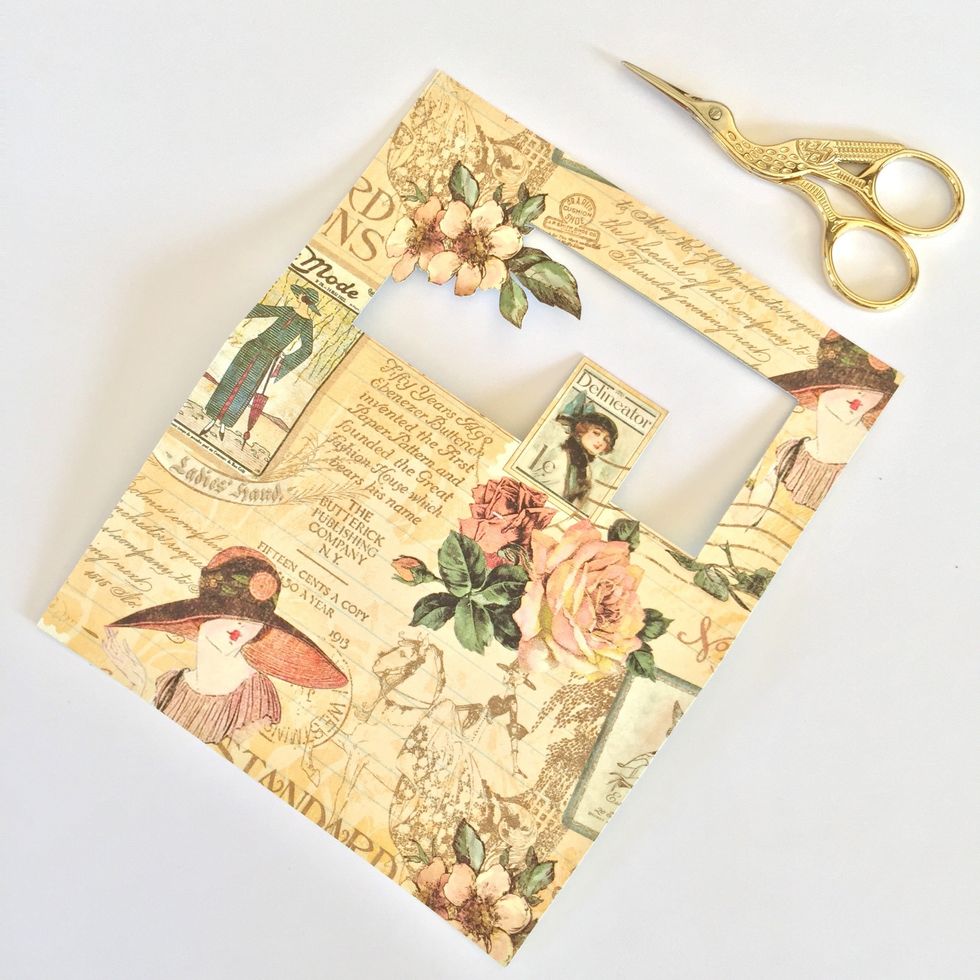 Make a window in the second page. You can cut it the way you like.