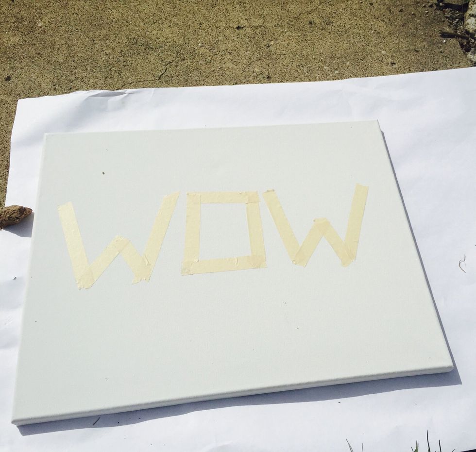 Make a word or design out of masking tape and place it in the center of the canvas. Make sure if your doing words they are short simple words that don't have curvy letters. (Look at mine above^)