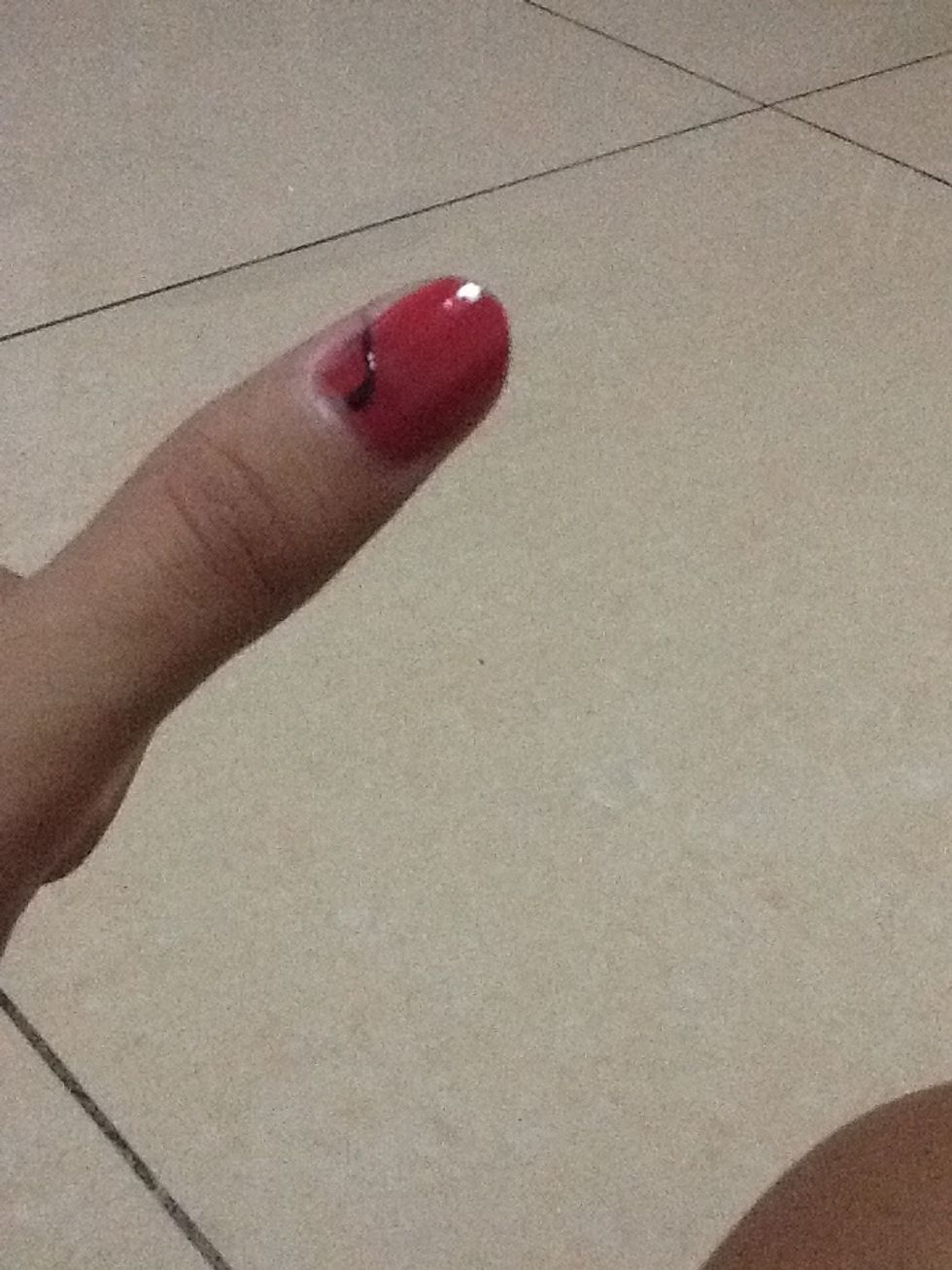 Make an ark on the left side of the nail sing a toothpick