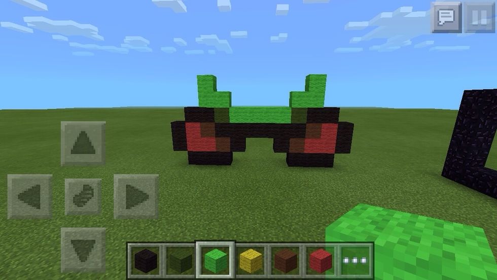 Make an 'L' and a backwards L with lime green wool.