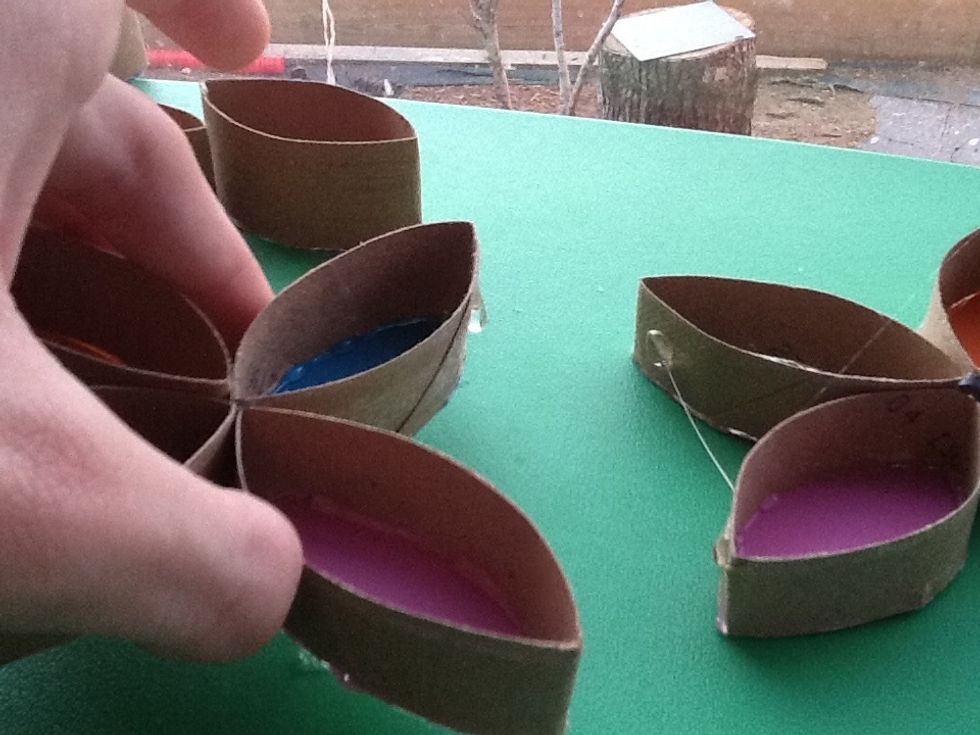 Make another flower and glue them together like this