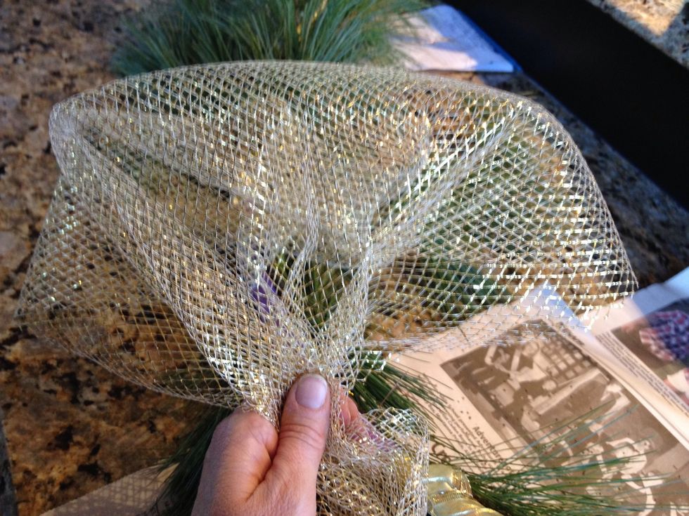 Make another gather using about 10 inches or so of fabric. Eyeball it...don't worry about exact measurements. Wire this gather onto the hoop about 6 inches or so from the previous one.