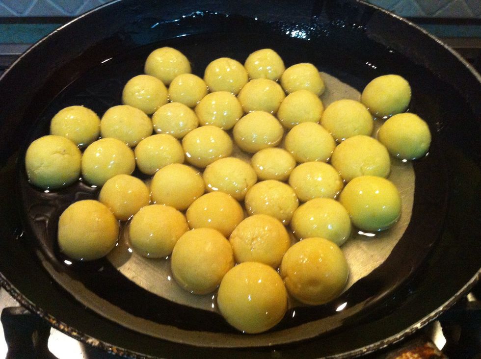 make balls, add oil in pan and add your balls in your oil before heating oil.. and then heat it on medium heat