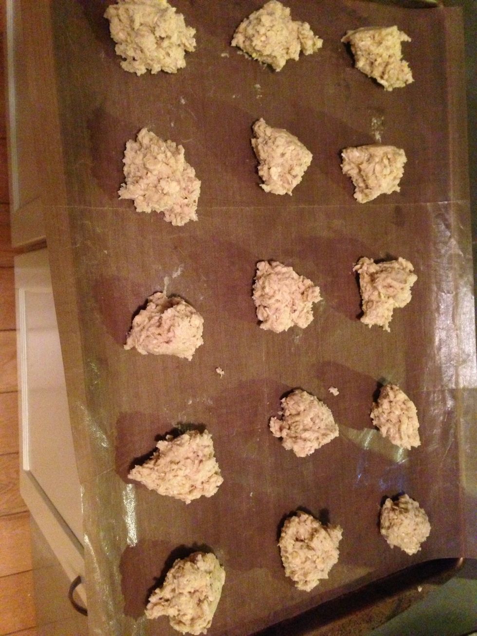 Make balls and place on a baking sheet (I use a silicone liner for easy cleanup). About 2 tbsp per cookie.
