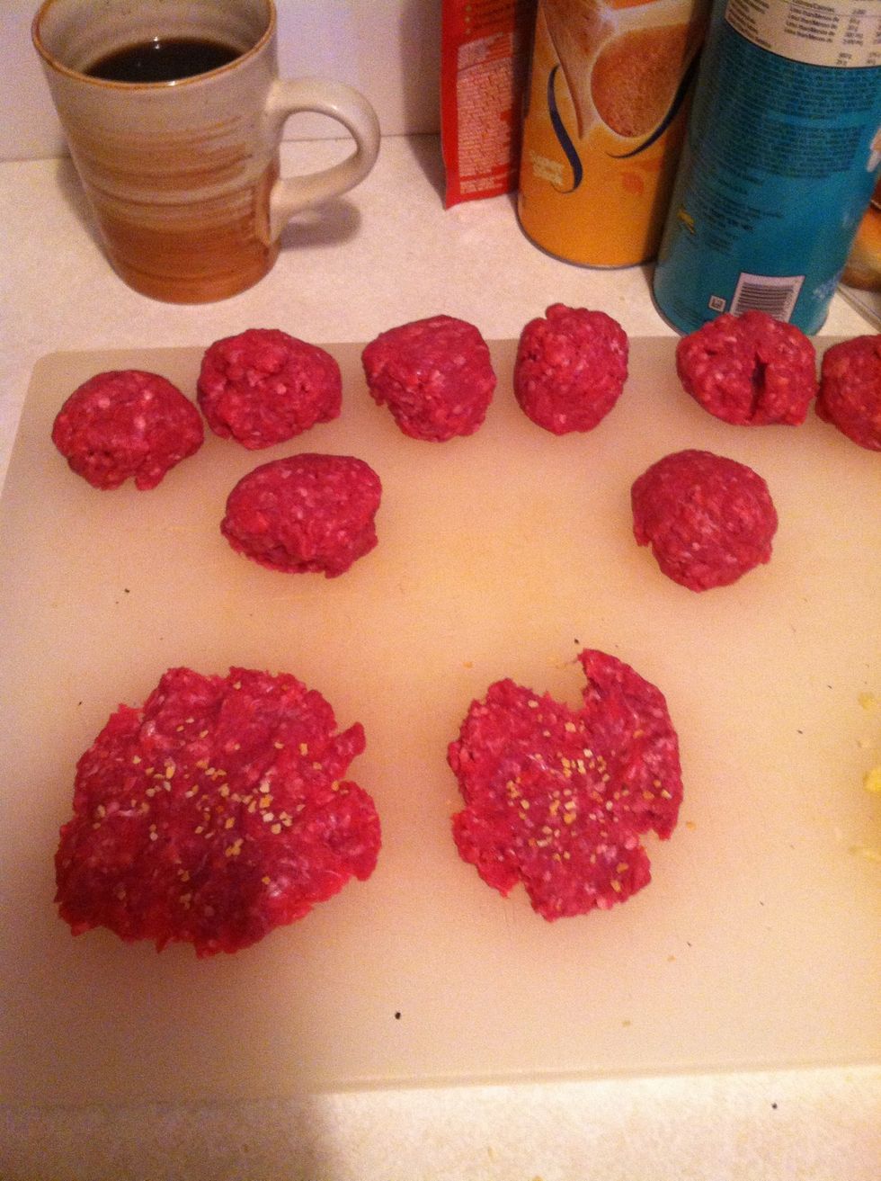Make balls of equal size with the ground beef a then start smashing them and adding your ingredients.