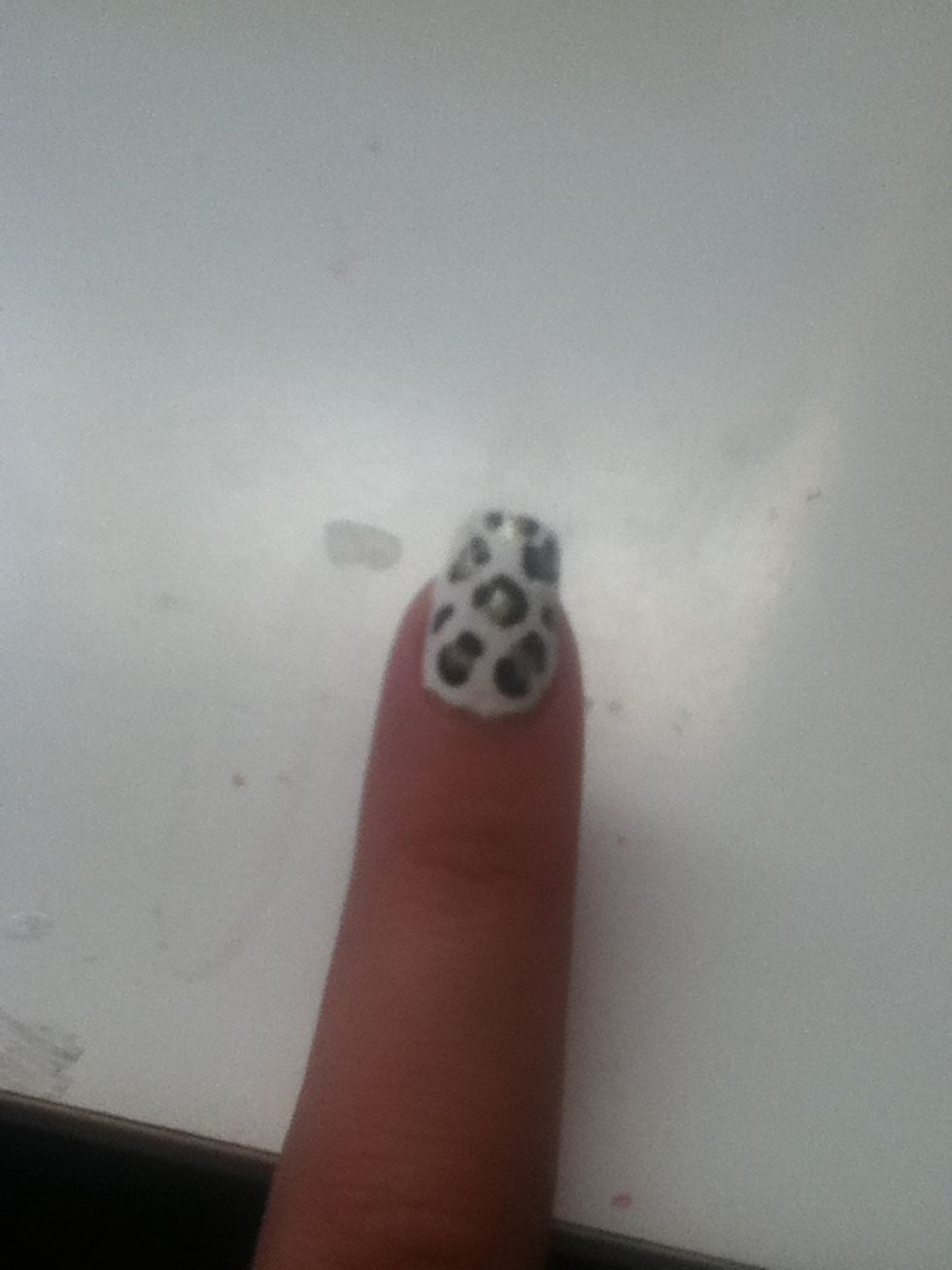 Make c's around the dots. Some should be bigger and some smaller than others. Then make random dots/lines with black polish.