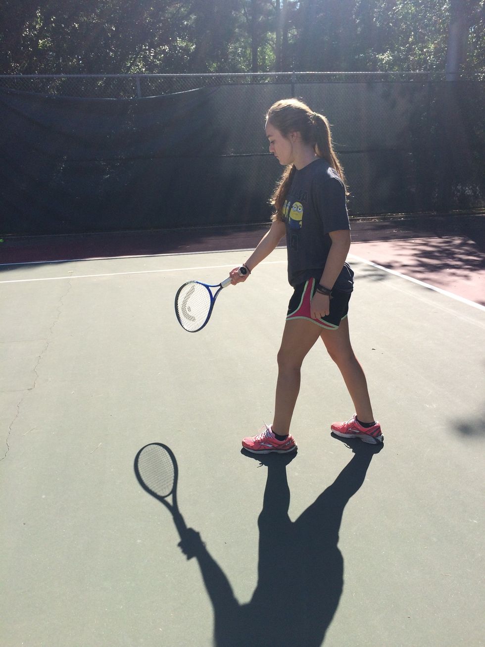 Make contact with ball in front of body.