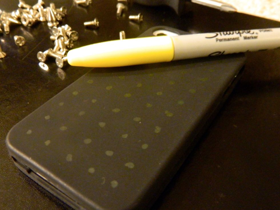 Make dots to mark where you will put your studs, cut small holes with the tip of the scissors for the screws.