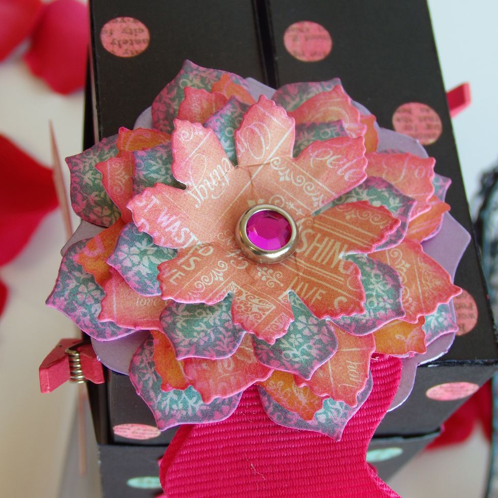 Make Flower button  Adhere flowers and stapes with brads  Front just like this