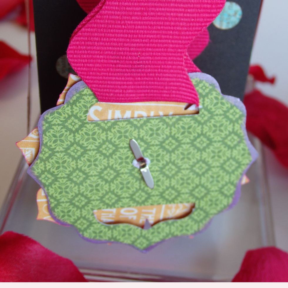 Make Flower button  Adhere flowers and stapes with brads Show Back side
