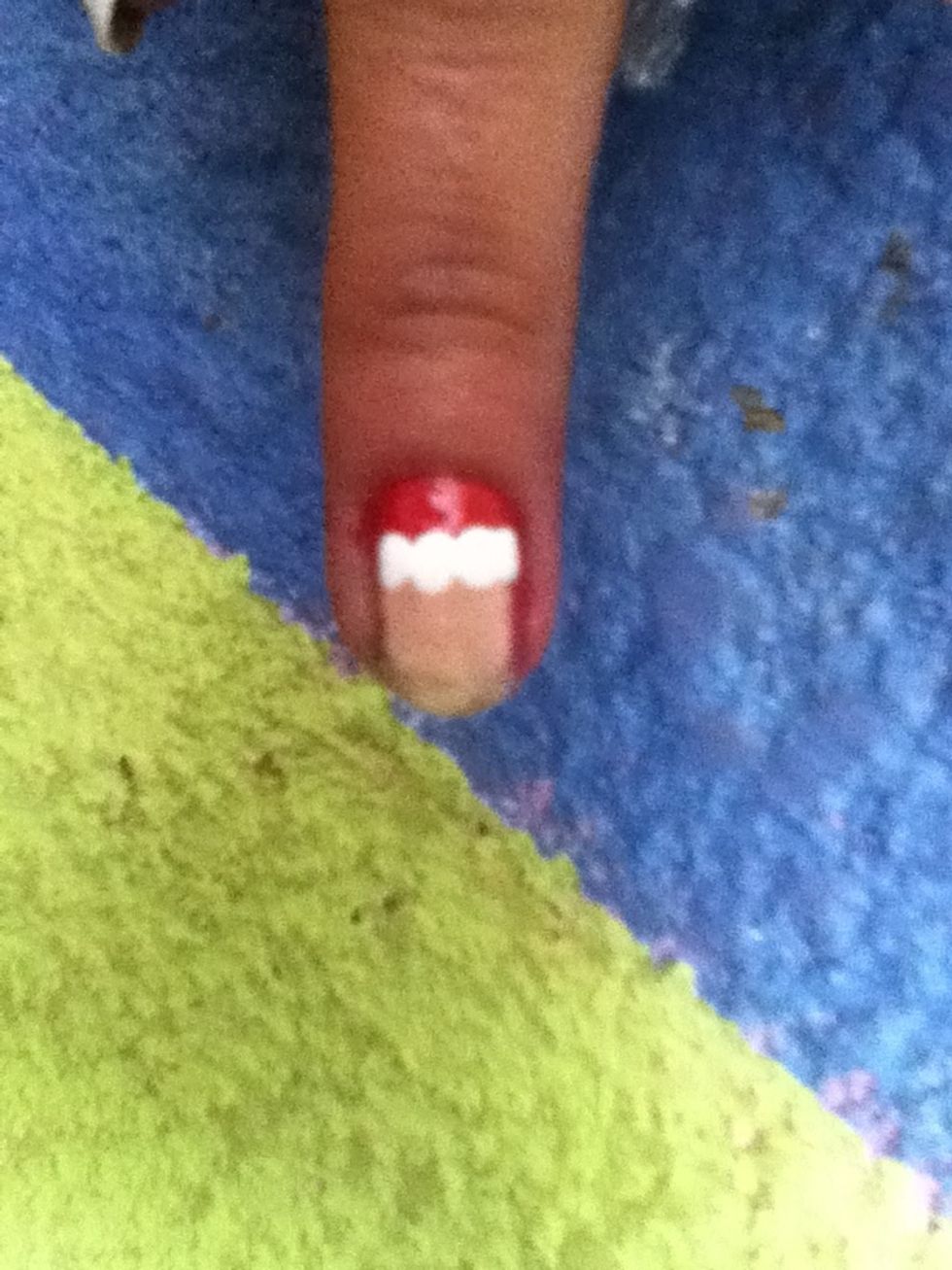 Make four white dots with a dotting tool,after that make a square with nude polish
