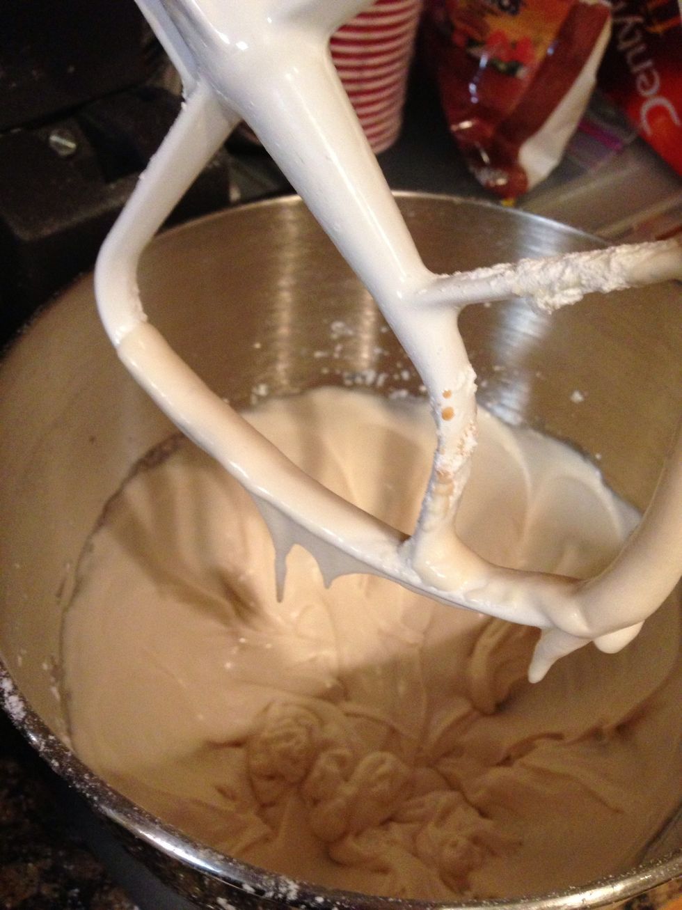 Make frosting.  Cut off about 2Tbsps butter about 2c powdered sugar 1tsp vanilla and a pinch of salt. Add milk while blending to make a stiff mix then add a few more drops of milk.