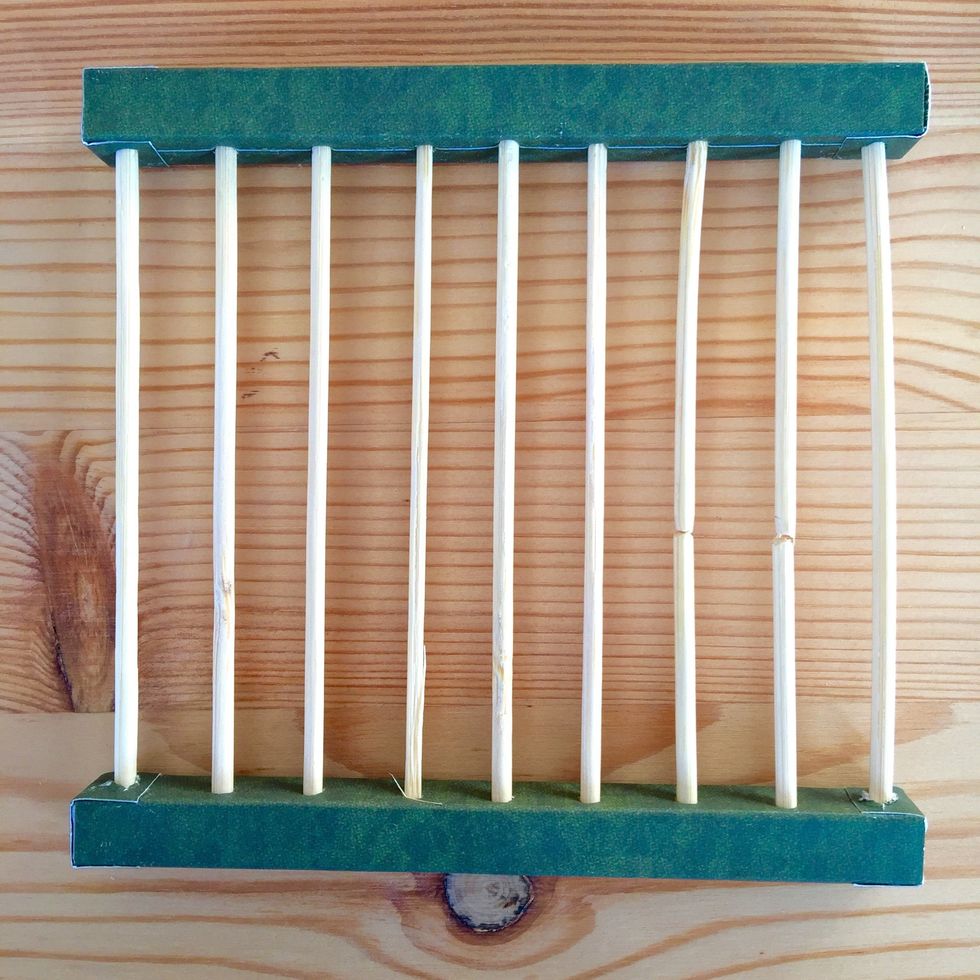 Make holes on the two pieces and insert the skewers.