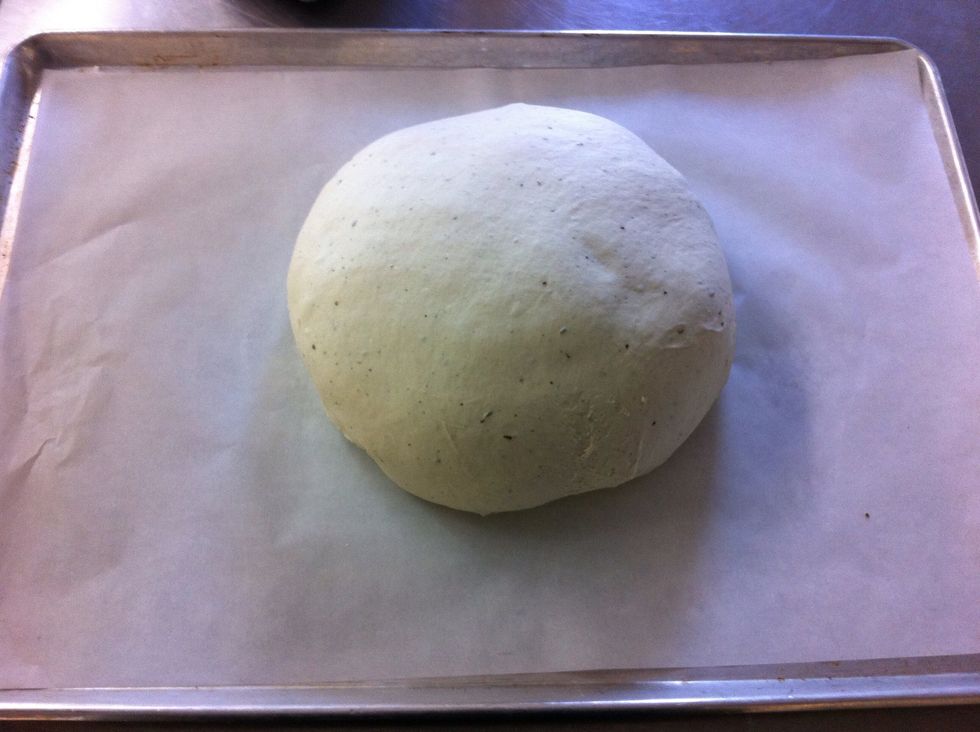 Make it into a ball by stretching one surface over and tucking all the ends under.