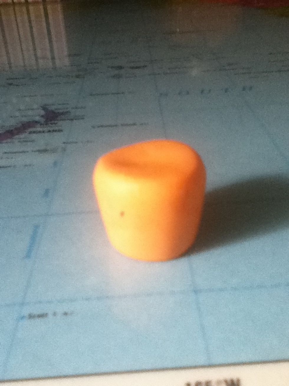 Make it into a cylinder but bigger on the top