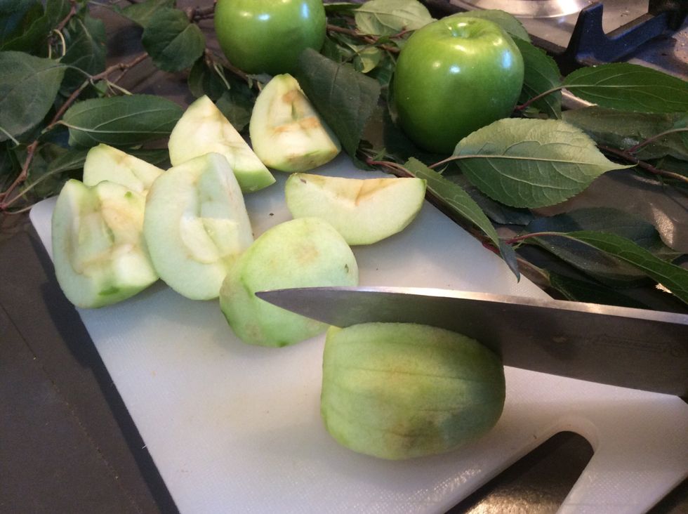 make lengthways cuts into rounded sides of apple quarters, cutting about three quarters of the way through