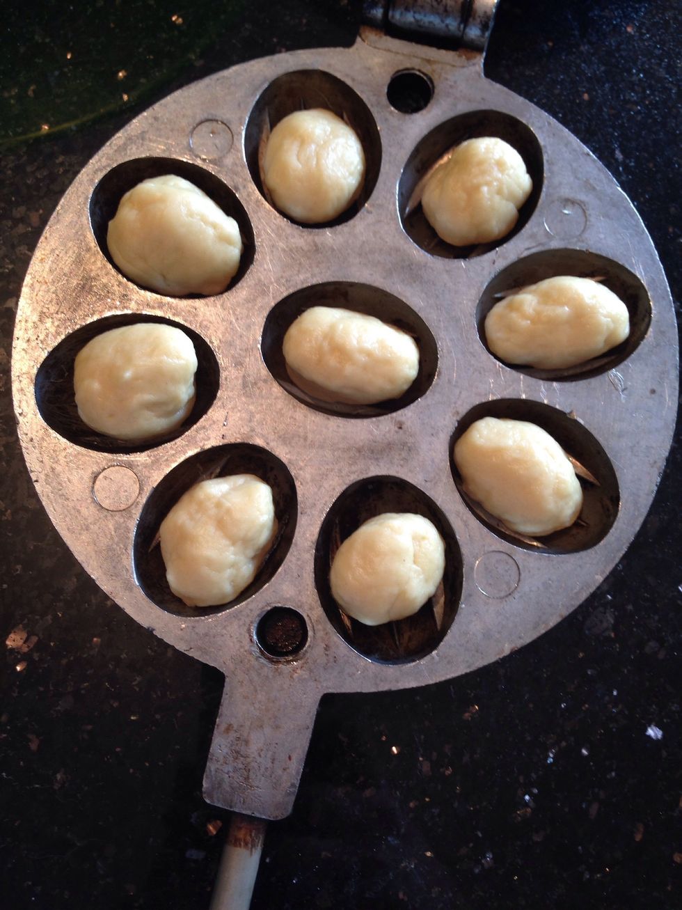 Make little balls and place them in the form, press well and bake on the stove turning occasionally. So both sides cook and turn brown