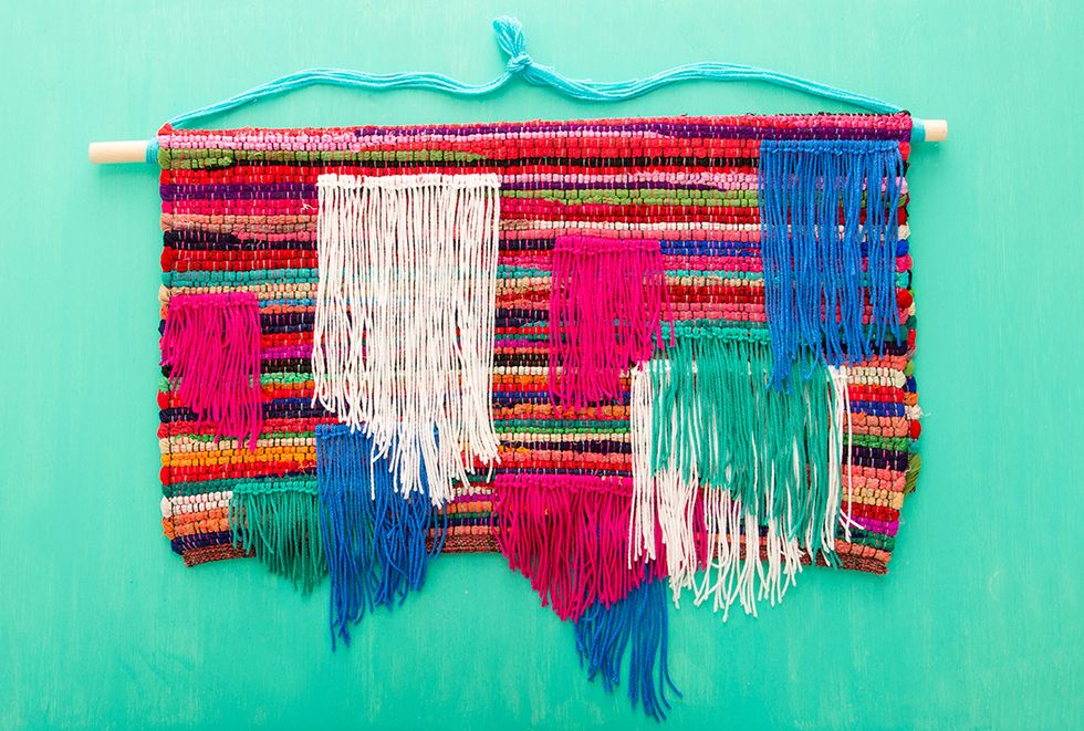 Make more lines of yarn in different colors up to the halfway point on your rug.