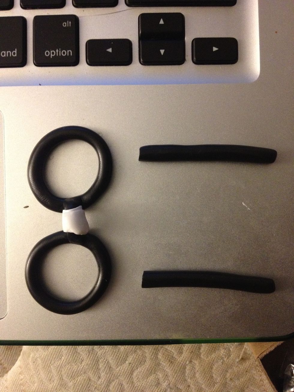 Make more thin, black cylinders for the "temples"(parts that go behind your ears). Curve them similarly to the bridge so that the glasses will be able to stand.