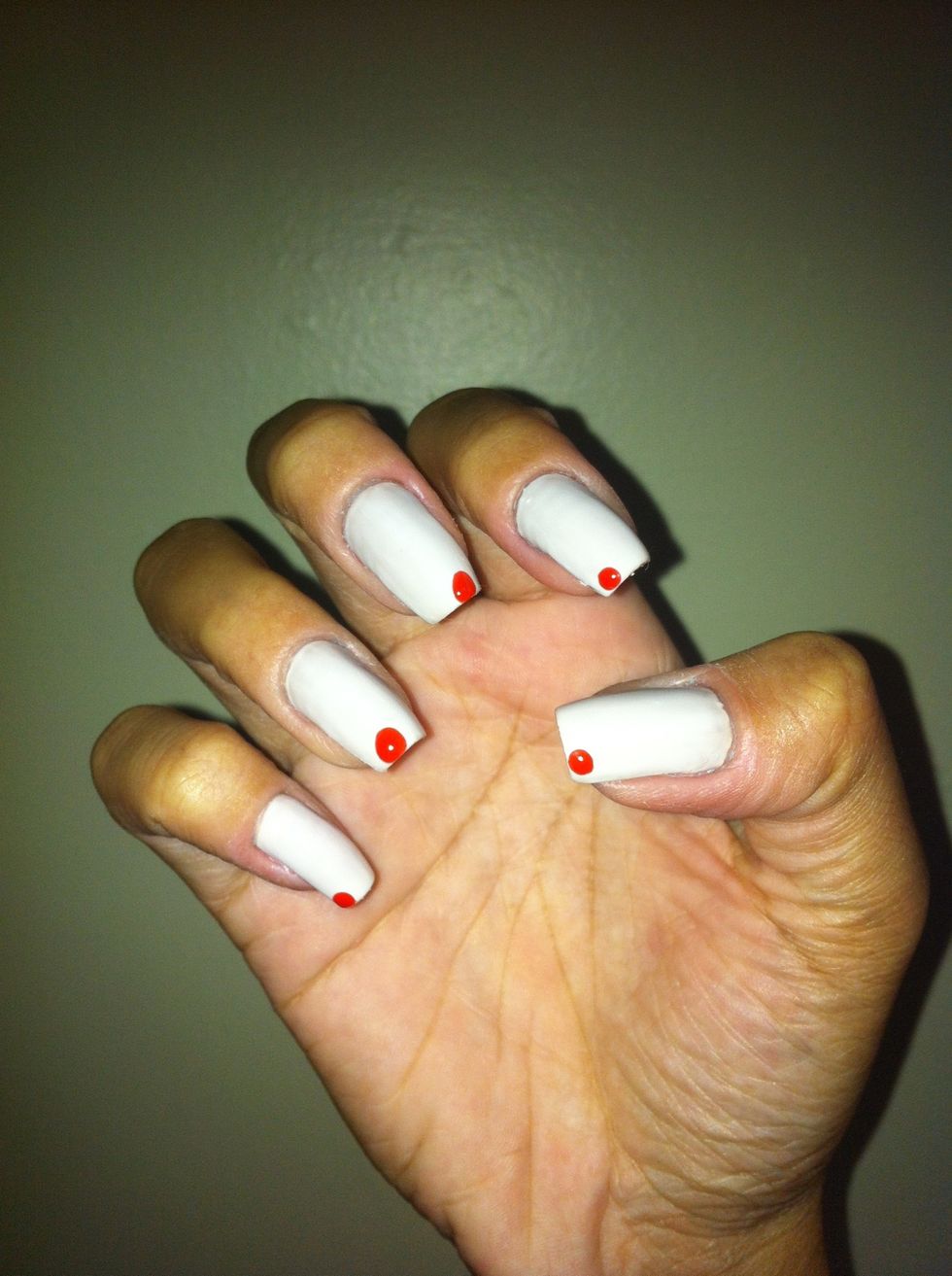 Make one red dot on your nails like the picture.