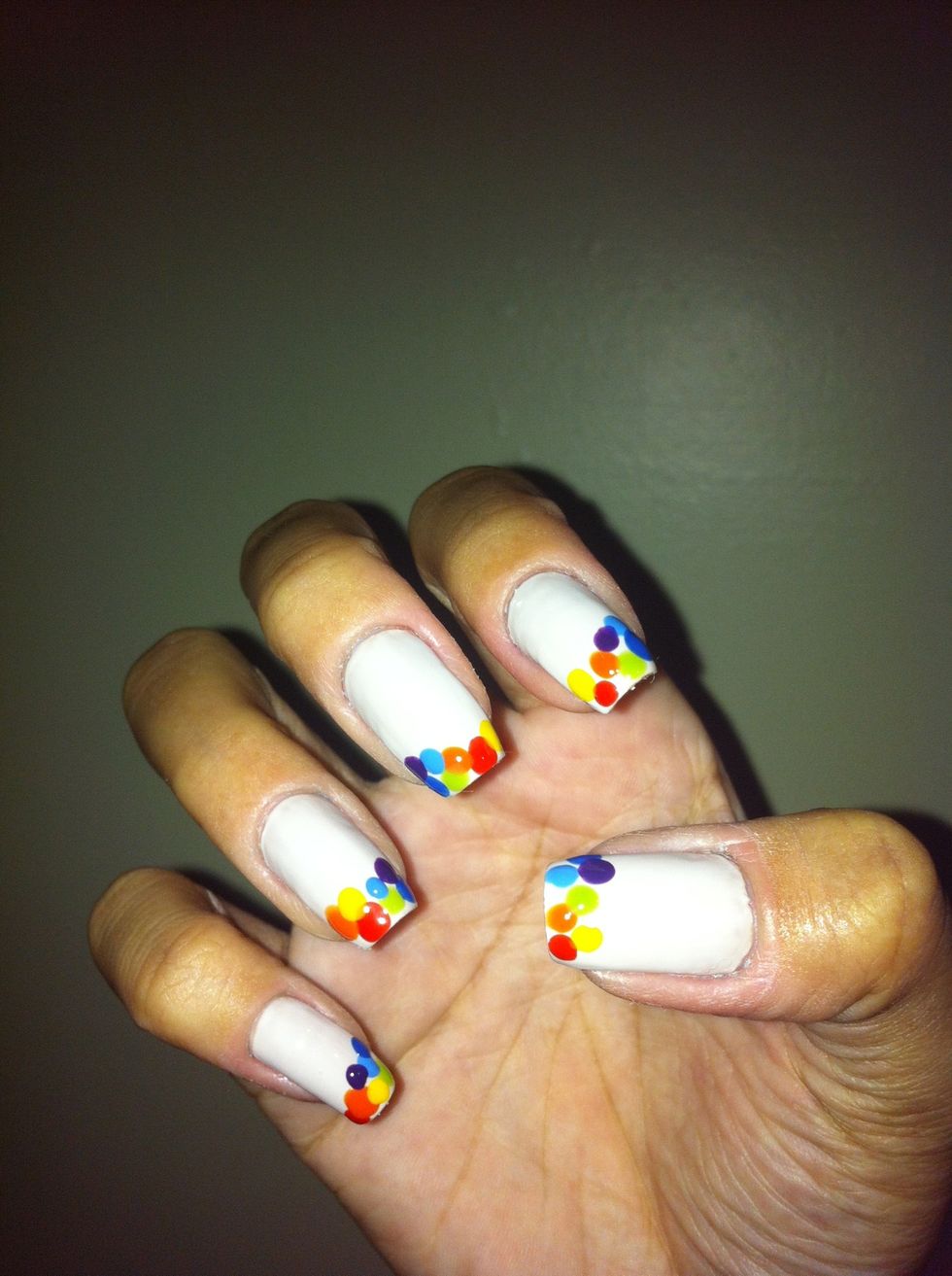 Make one violet dot on your nails like the picture.