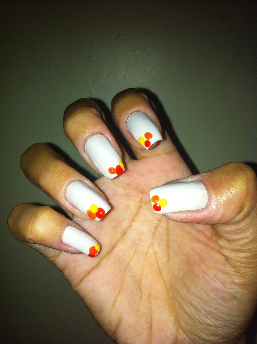 Make one yellow dot on your nails like the picture.