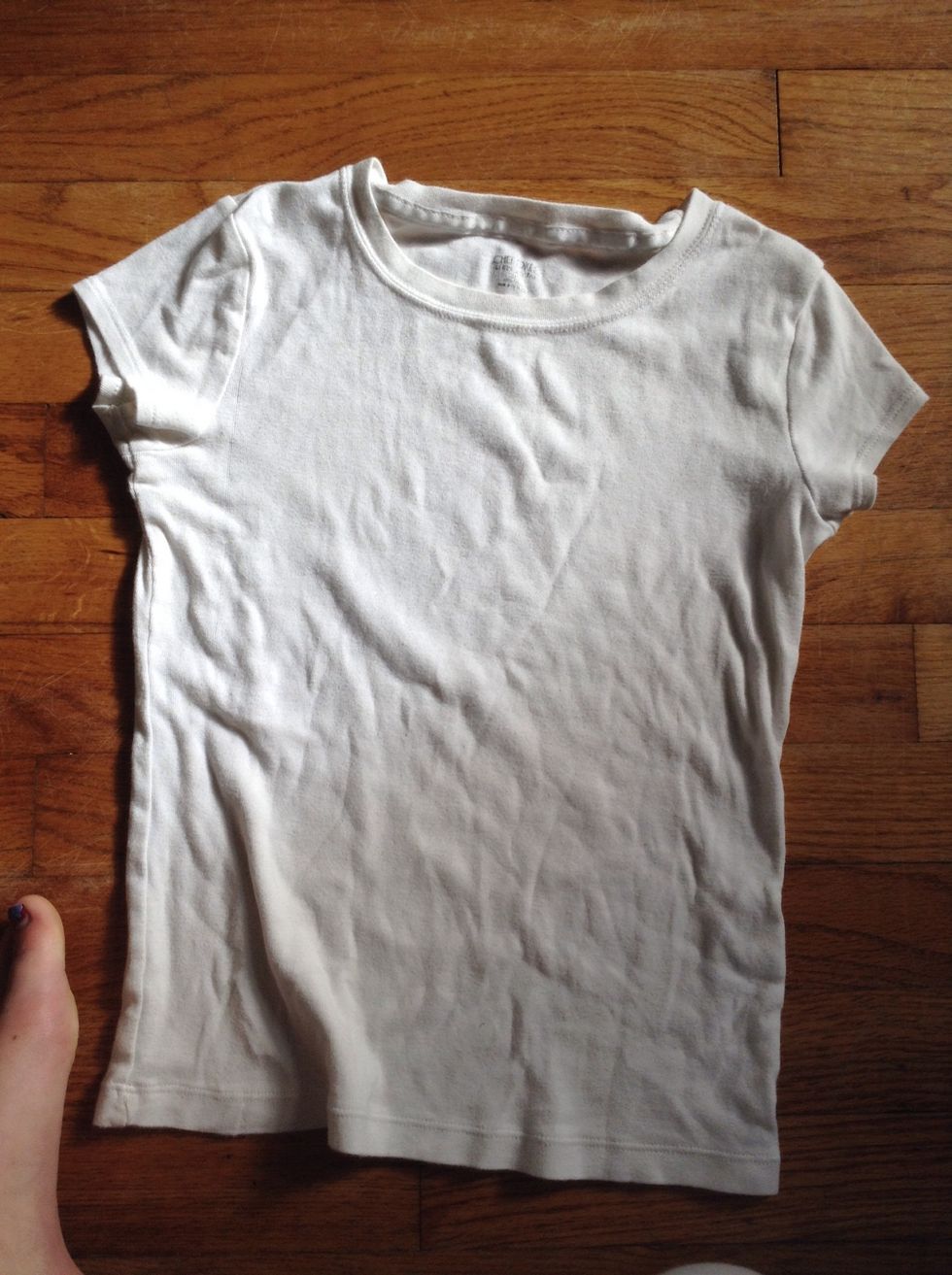 Make pencil marks at the neckline, sleeves, and bottom of where you want to cut it.