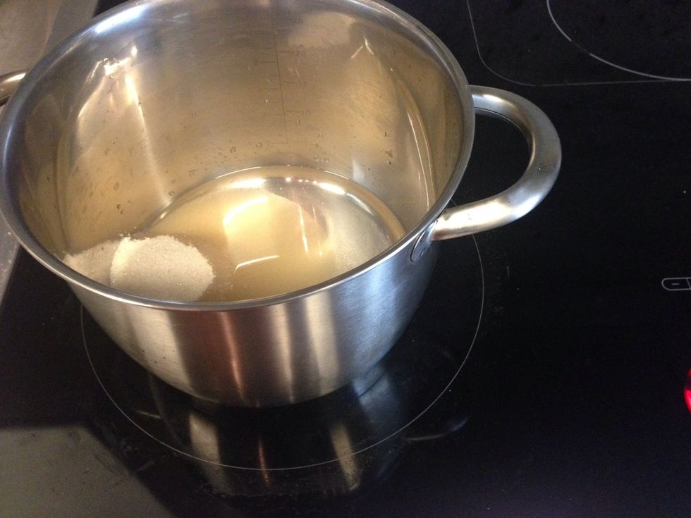 Make simple syrup by combining 1/2 cup sugar and 1/2 cup water in a pot and cooking over medium heat-high heat.