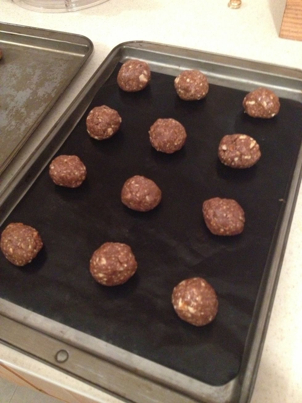 Make small balls with the dough... Or big ones it all depends how big you like your cookies :) and while you do it eat some cookie dough!!