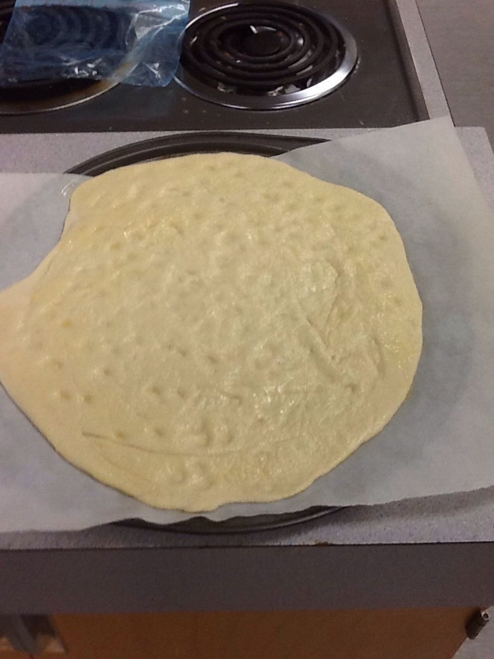 Make small indents in the dough and brush the butter on the dough :D