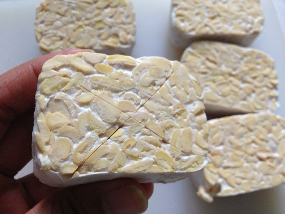 Make some incision on each side. This to help the tempe absorbs the spices more