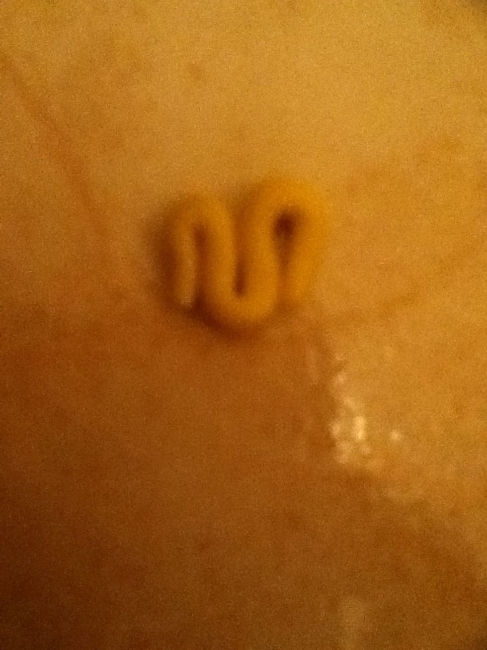 Make some mustard by taking some yellow playdoh Rolling it with your fingers then swirling it