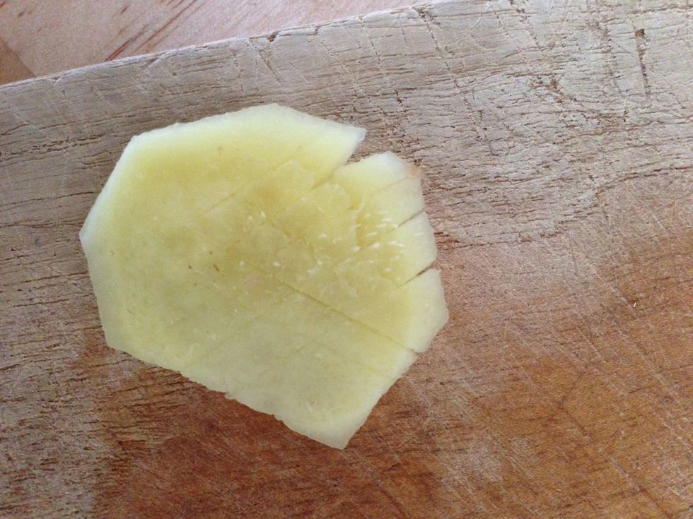 Make some small cuts and crush It with the side of the knife