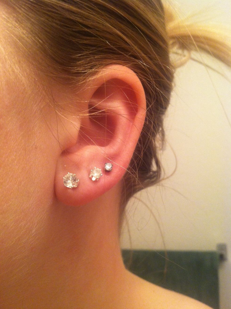 Make sure all of ur hair is up and ou of the way from ur ears.