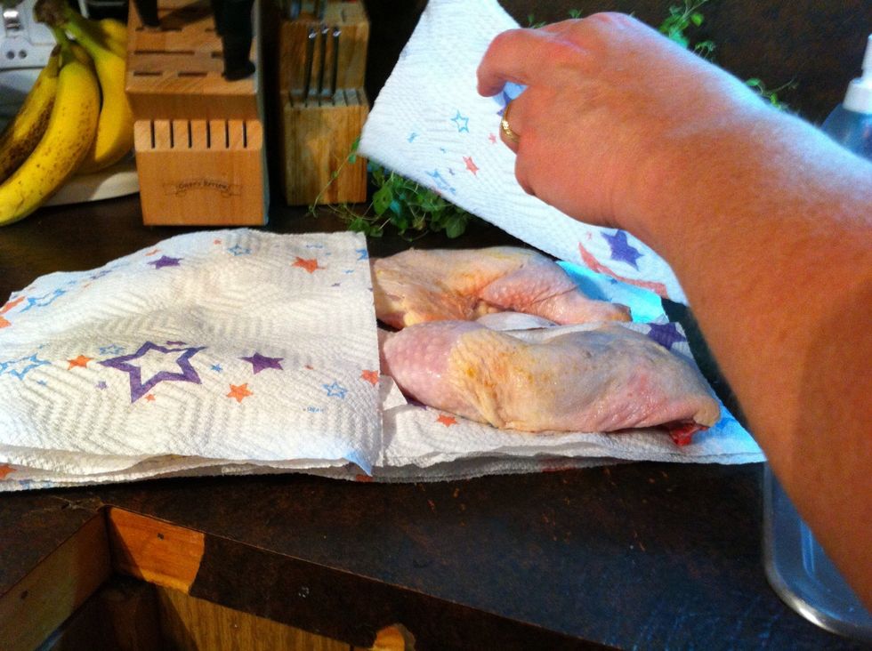 Make sure all the chicken is dry. This gives you a crispy skin. I put paper towels under and on top.