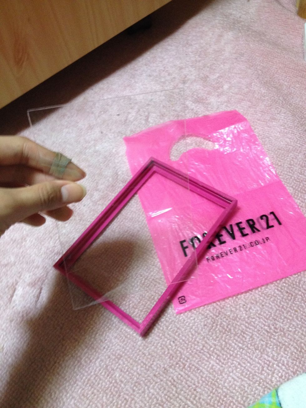 Make sure it has either glass or plastic in the frame to hold the bag in