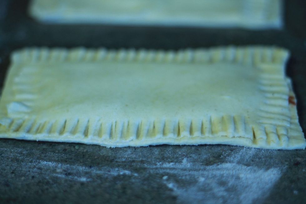 Make sure it seals well. If you find the pastry is not sticking, just wet the edges with a bit of water with your finger and then press together.