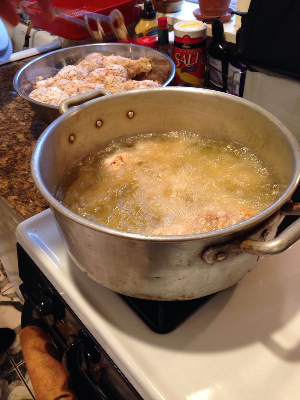 Make sure majority of the chicken is submerged in the oil. Don't over crowd the pan! Turn the chicken about every 2 minutes.