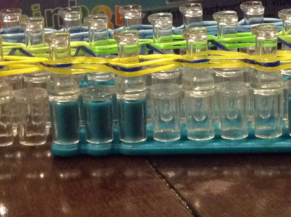 Make sure on both of the sides, the dark blue rubber band is in the middle and and the color of the other rubber band is on the outside. Check the other side