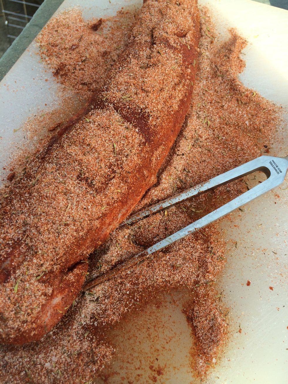 Make sure that the entire loin is thoroughly coated. The pork can rest and absorb the wonderful flavors of the smoked paprika while you prepare the grill.