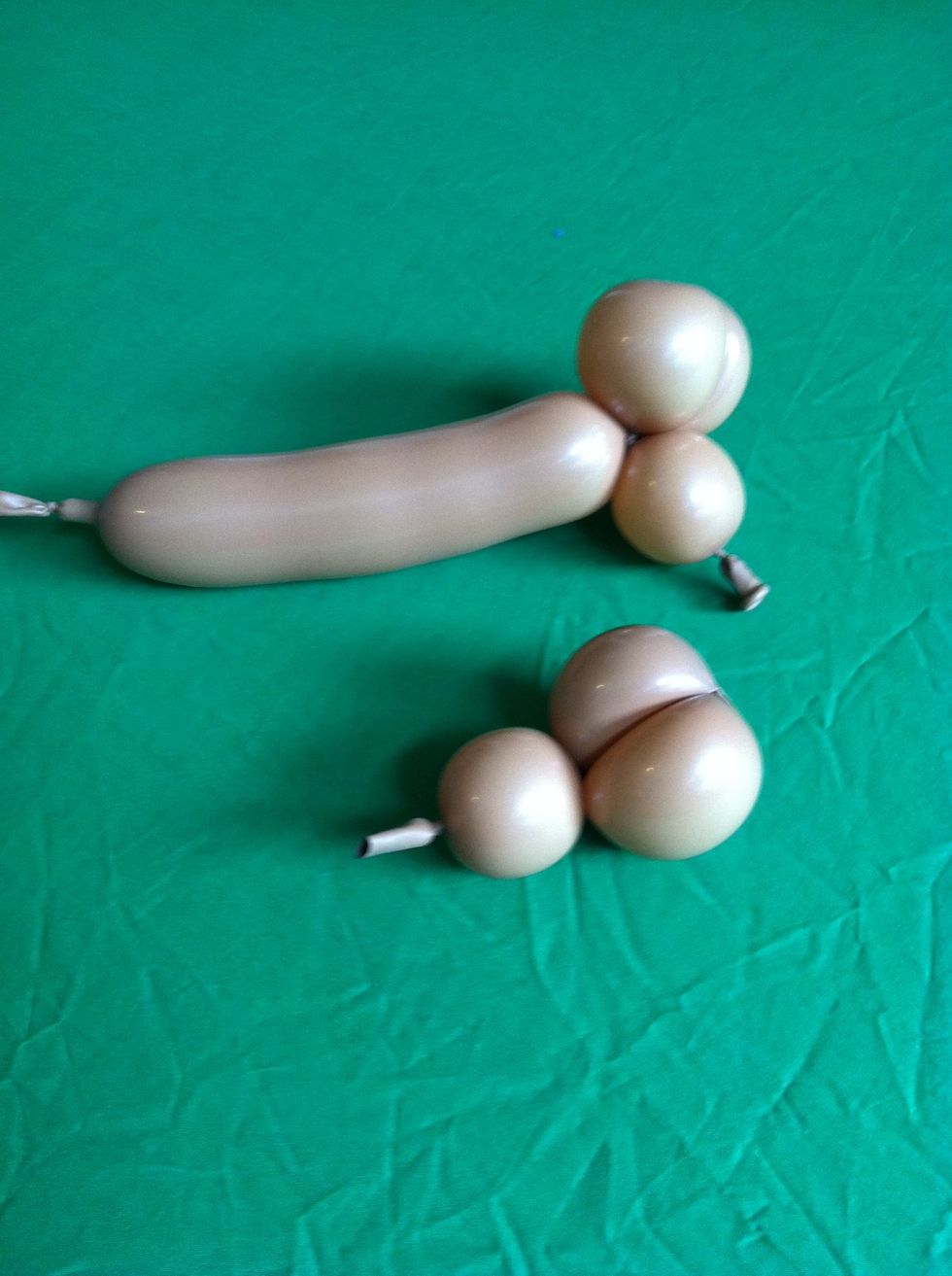 Make sure the balloon is secure and then cut off excess of both balloons