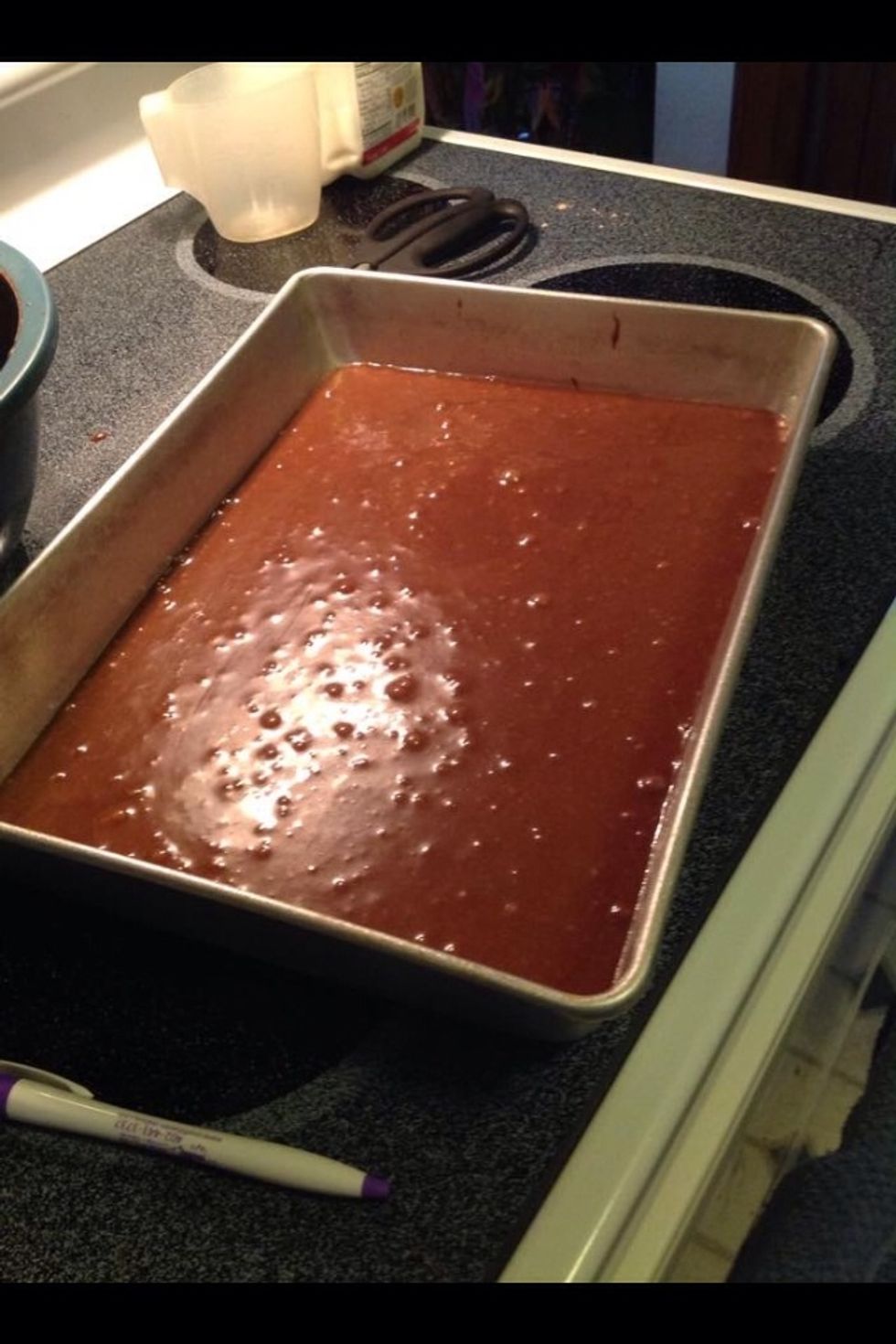 Make sure the brownie batter is evenly spread in pan.