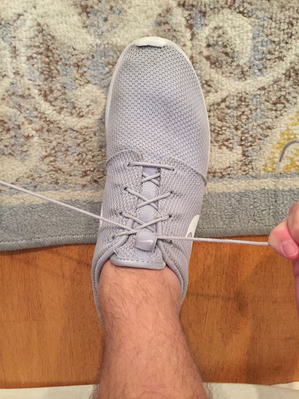 Make sure the "crossed over" part of the lace is tight up against your arch